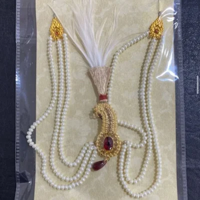 Gold Finished Red Emerald Kalgi with White Feather & Pearl Mala
